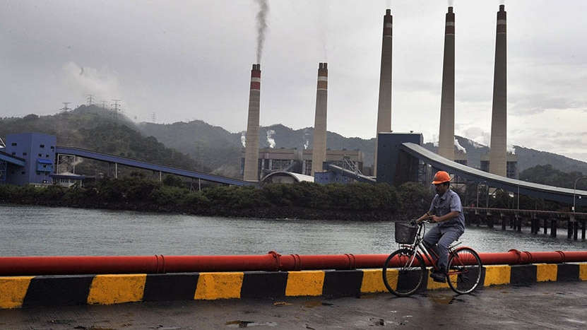 A worker checking in the area of the coal-fired power plant in Banten.