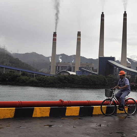 A worker checking in the area of the coal-fired power plant in Banten.