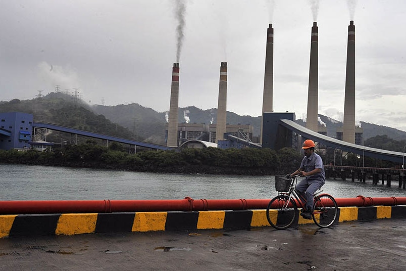 A worker checking in the area of the coal-fired power plant in Banten.