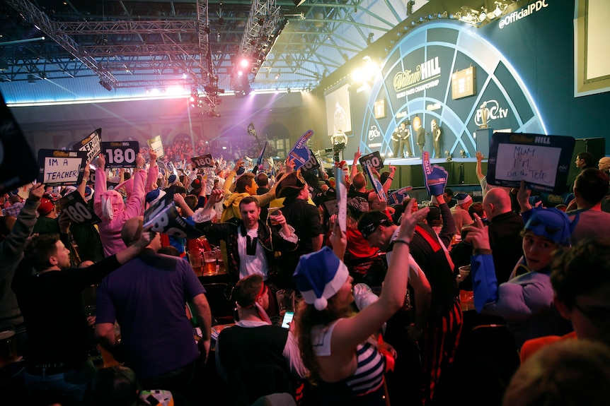 Packed crowd celebrate during the Gary Anderson v Adrian Lewis PDC World Darts Championship Final in 2016