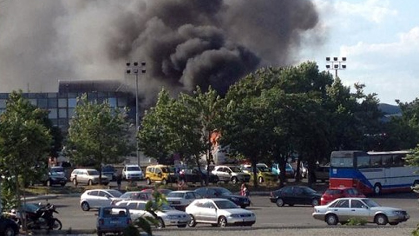 A picture shows smoke rising over Bourgas airport on July 18, 2012.