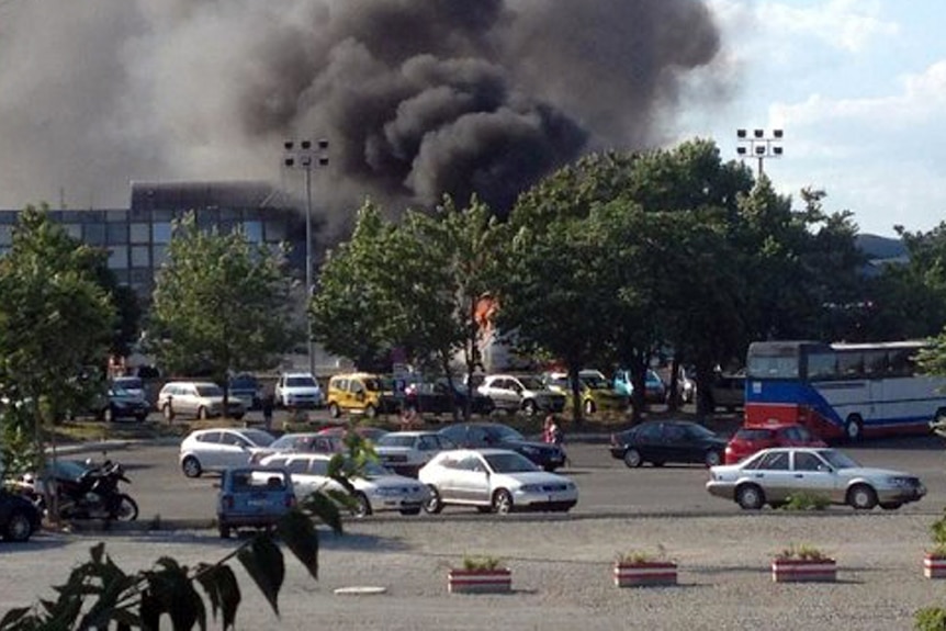 A picture shows smoke rising over Bourgas airport on July 18, 2012.