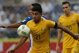 Massimo Luongo competes for the ball