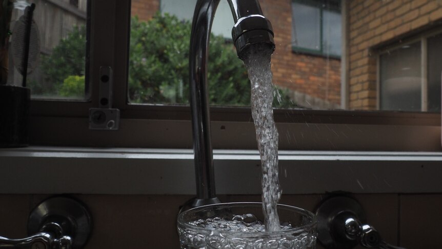 water streaming from a household tap