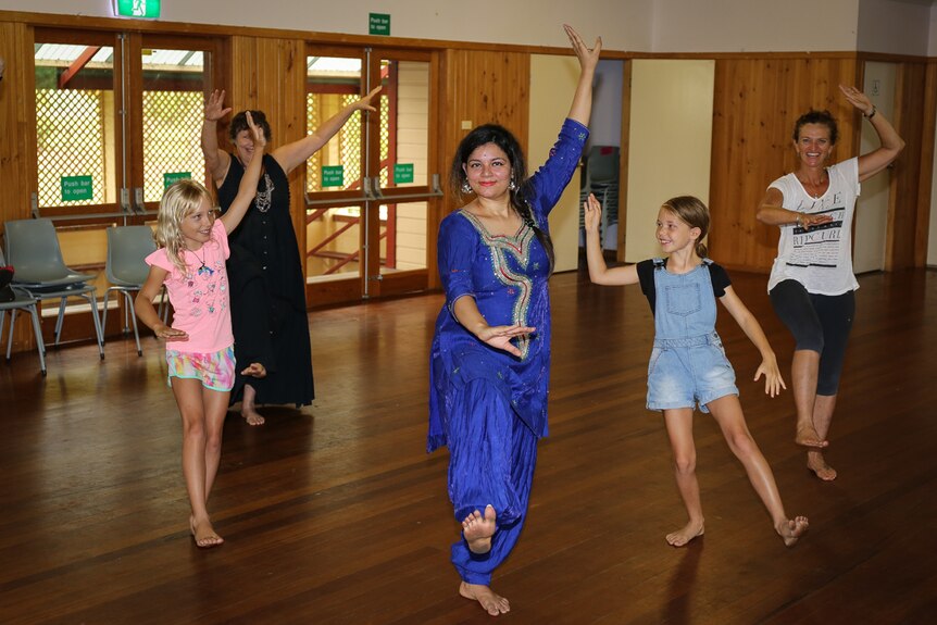 Manisha Jassal poses with some of her dance students