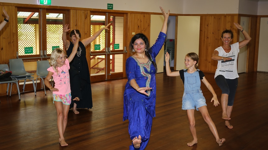 Manisha Jassal poses with some of her dance students