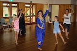Manisha Jassal poses with some of her dance students