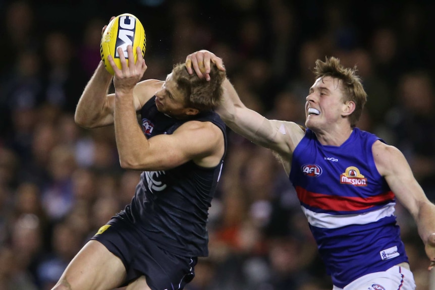 Carlton's Lachie Henderson and the Bulldogs' Jordan Roughead in action at Docklands.