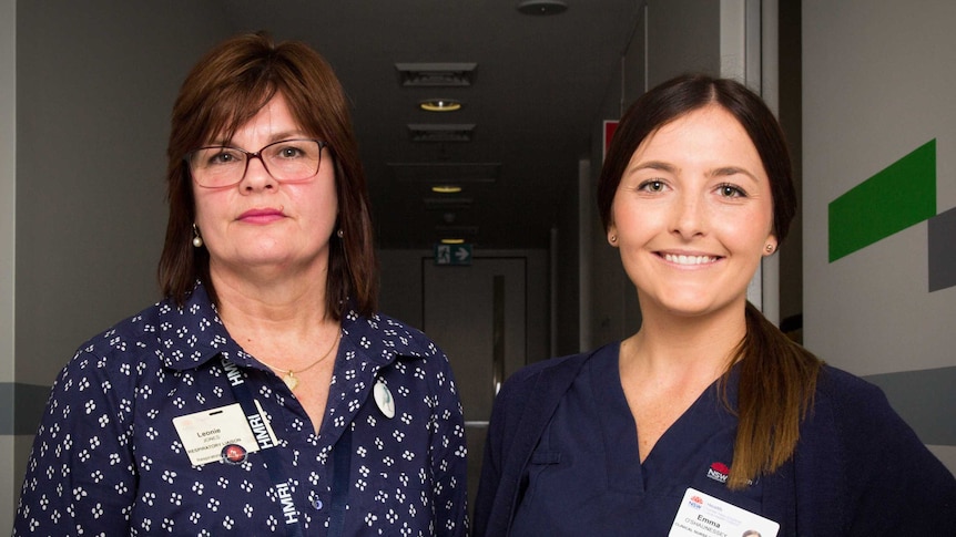 Leonie Jones and Emma O'Shaunessey stand in a hallway.