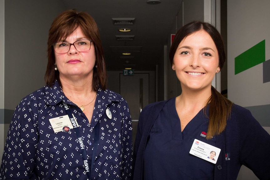 Leonie Jones and Emma O'Shaunessey stand in a hallway.