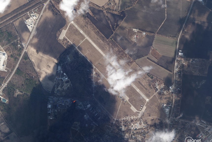 Flames and smoke from a strike at Vasylkiv Airbase can be seen on a satellite image.