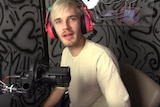 YouTuber PewDiePie sitting in recording booth