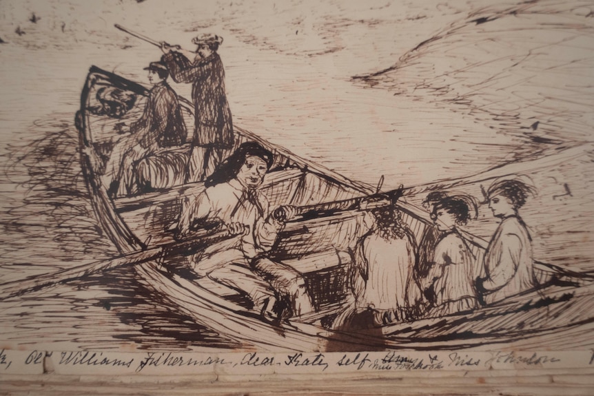 Three young women side in the back of a row boat while a man rows.