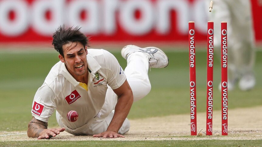 Brilliant run out ... Mitchell Johnson athletically catches Dimuth Karunaratne short of his ground.