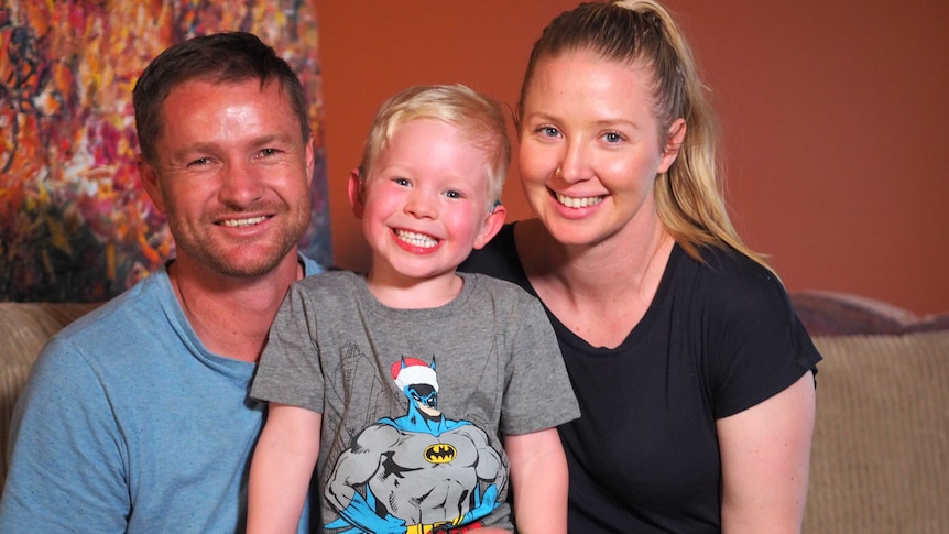 An image of Luke, Eli and Kiri Adamson in their home.