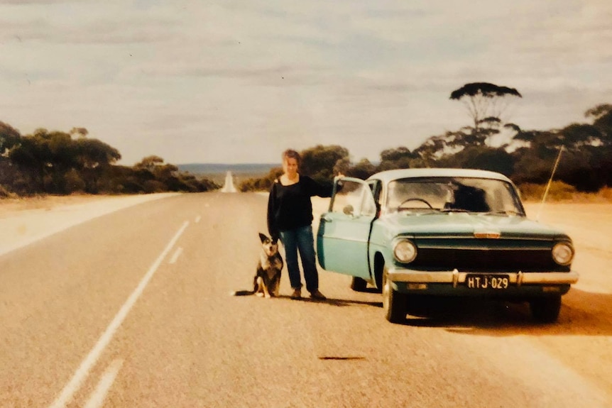 An old photograph of a woman and her dog and an EJ Holden