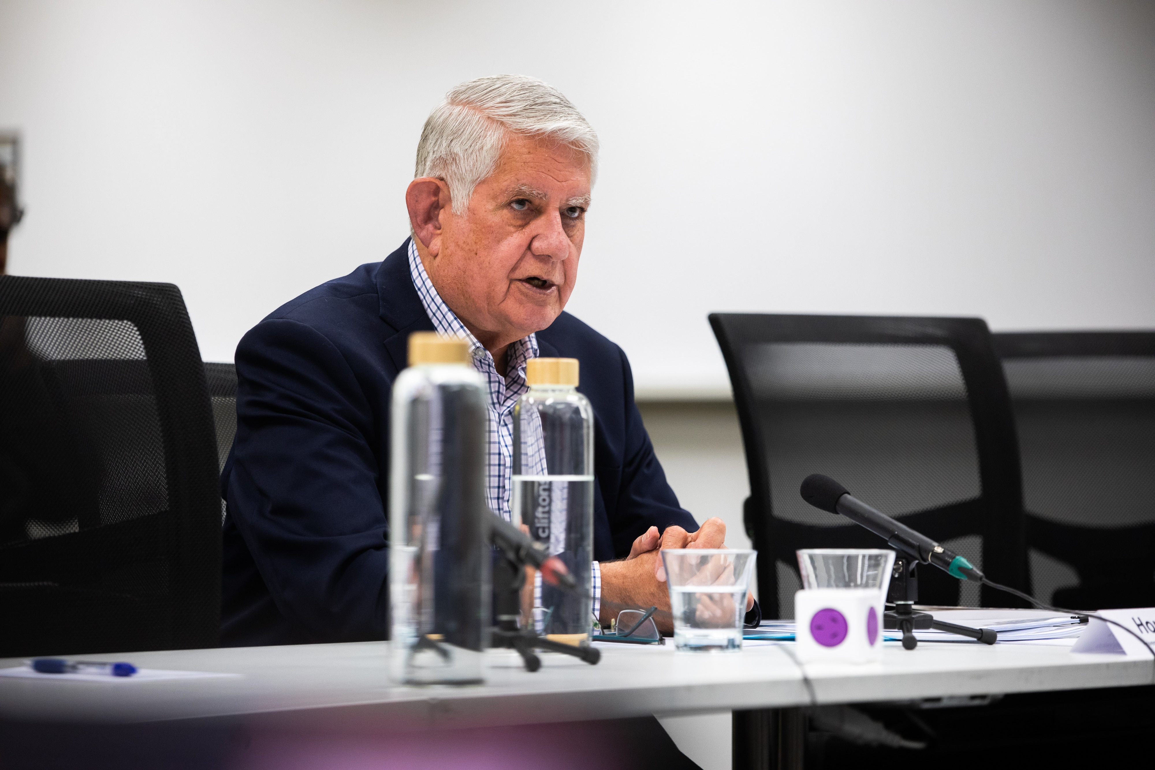 Former Indigenous Australians minister Ken Wyatt sitting at a table