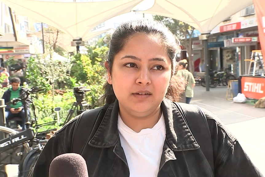 A woman getting interviewed on camera.