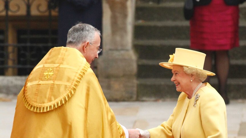 Britain's Queen Elizabeth is welcomed by the Right Reverend John Hall, Dean of Westminster