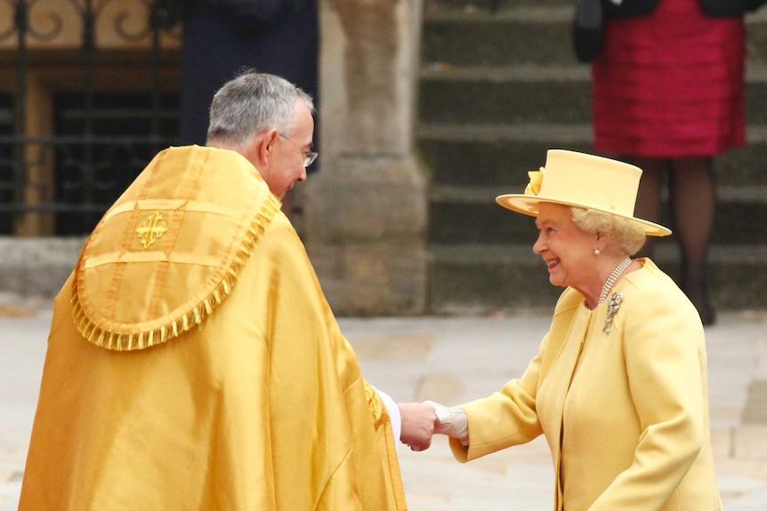 Britain's Queen Elizabeth is welcomed by the Right Reverend John Hall, Dean of Westminster