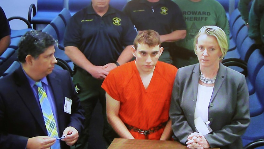Nikolas Cruz appears via video monitor at a bond court hearing after being charged with 17 counts of premeditated murder.