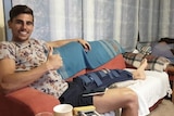 Spanish footballer Javi Verdu Sanchez sitting on a couch.