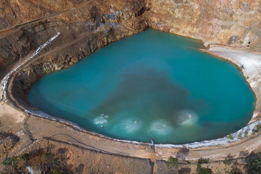 A large mine crater filled with water.