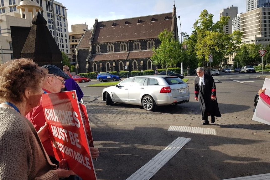 Protesters gather outside St Patrick's Cathedral as the 2020 Red Mass begins.