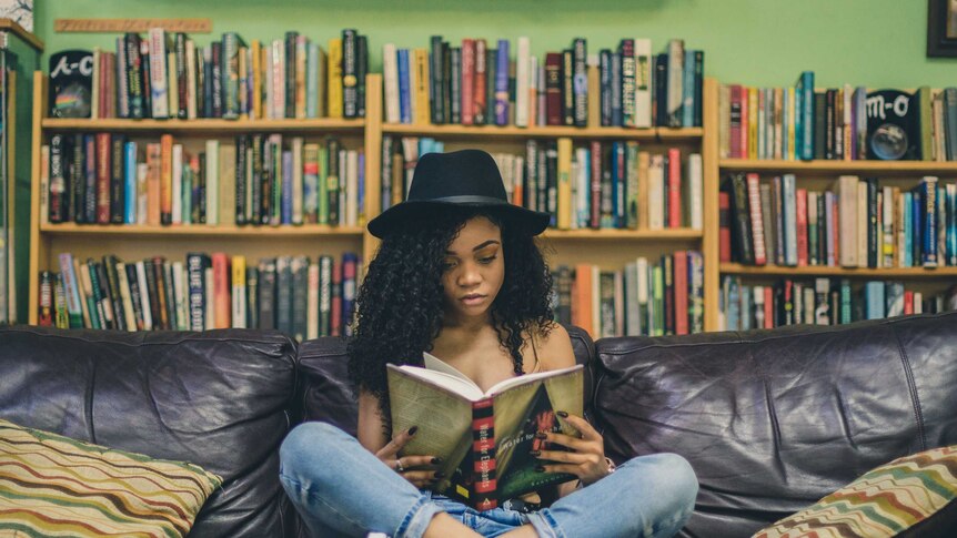 Girl reading on a couch