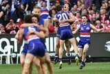 Western Bulldogs players react after winning the AFL grand final against Sydney.