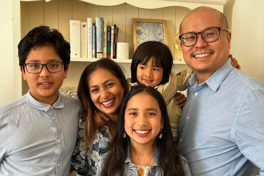 John Ng and with his wife and children