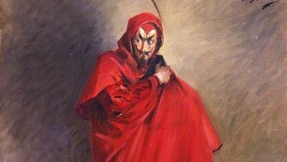 An evil-looking character with stark black moustache, goatee and eyebrows in a vivid red cloak.