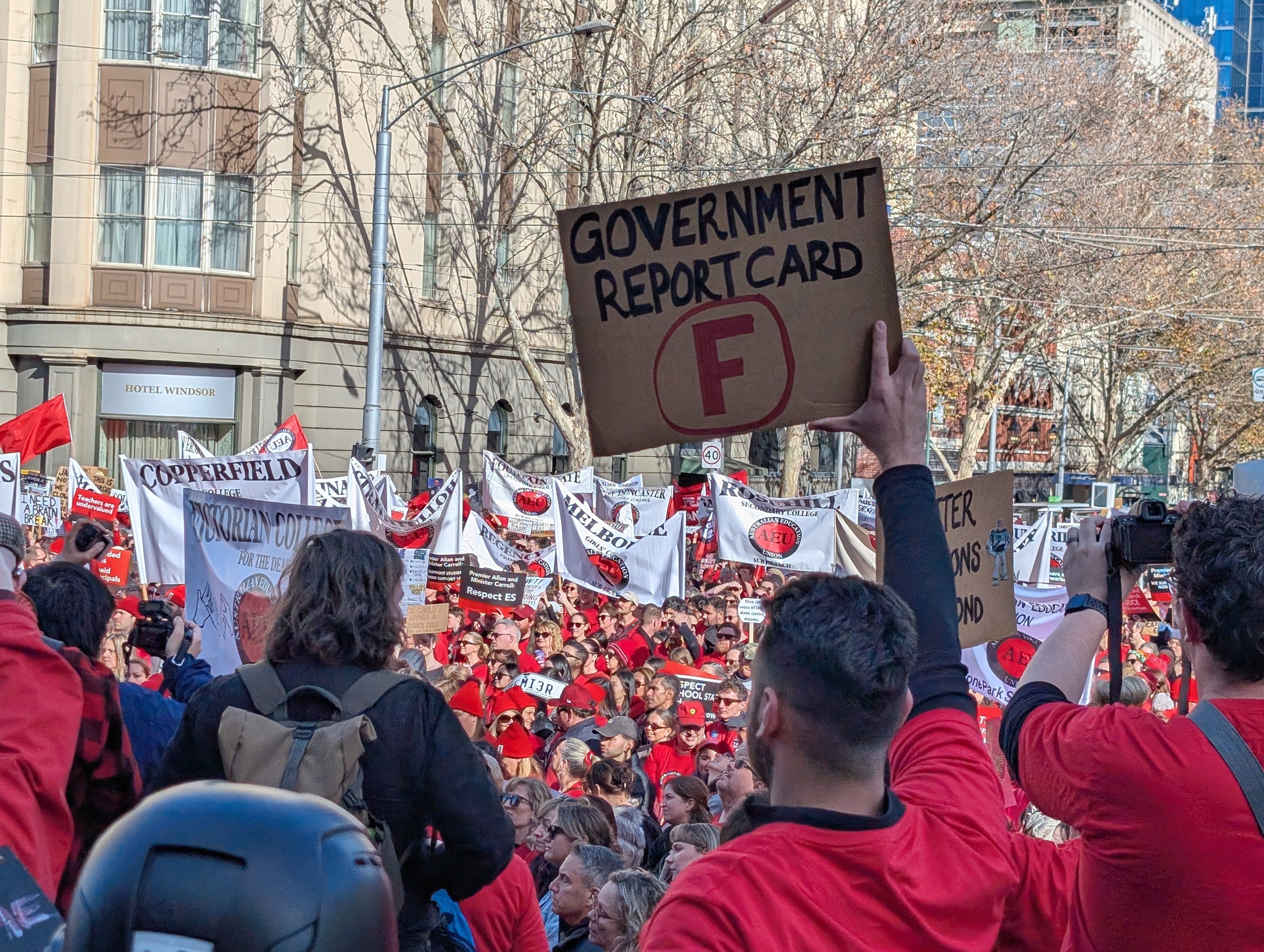 A protester holds a sign that says 
