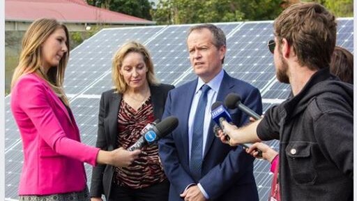 Alannah MacTiernan and Bill Shorten are interviewed by the media in front of a solar panel.