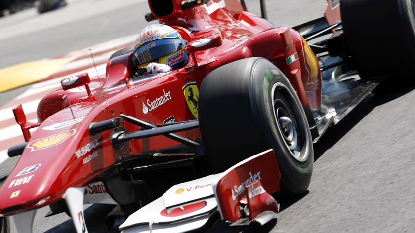 Alonso cruises around the Monaco street circuit during practise