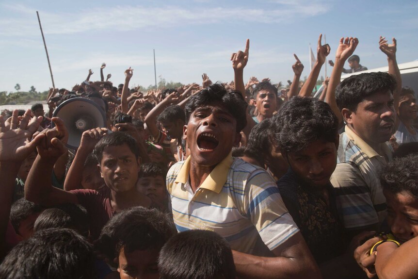 A Rohingya boy shouts in a throng of people during protests in a Bangladeshi refugee camp against their repatriation to Myanmar.