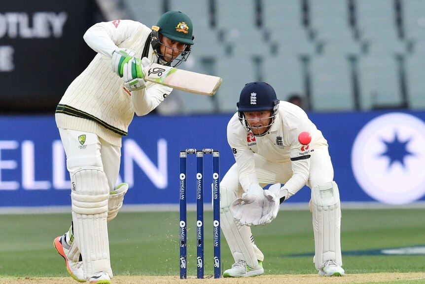 Australia's Usman Khawaja drives in Adelaide against England