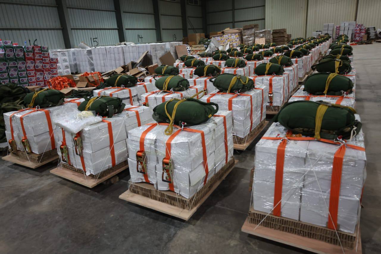 Boxes being lined up in a room.