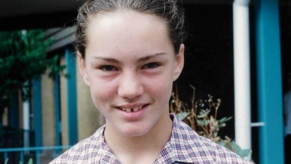 A girl in a school uniform.
