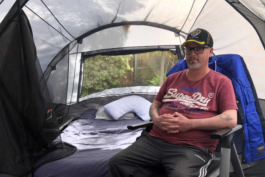 A man living in a tent.