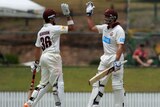 Nathan Reardon and Peter Forrest celebrate victory for Queensland on day three.