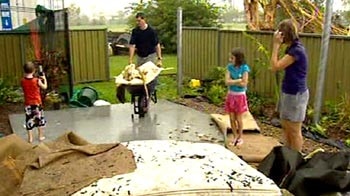 Clean-up: cyclone-affected areas will be classed a disaster zone for at least another week.