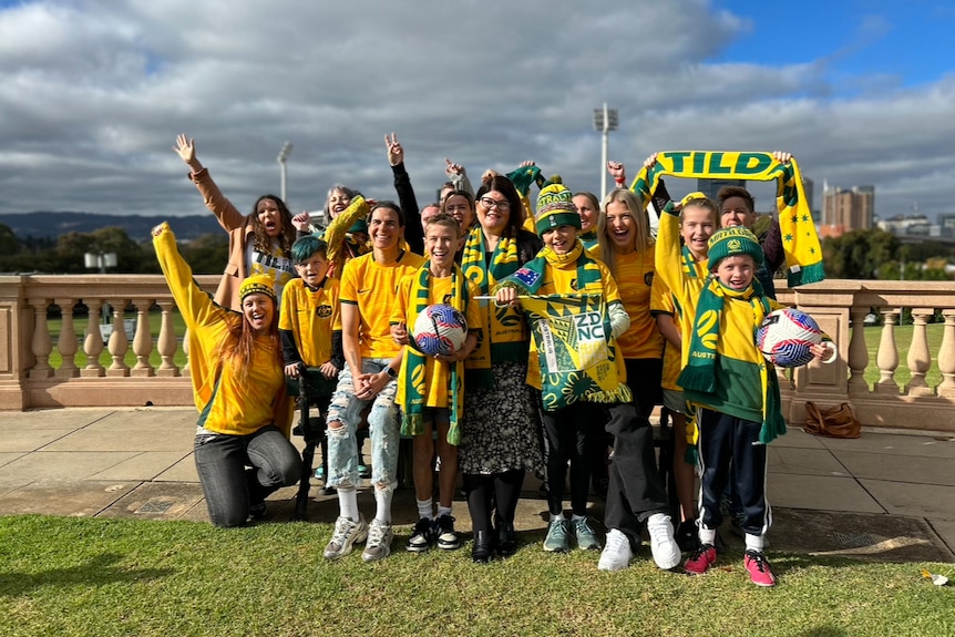 Matildas players with fans.