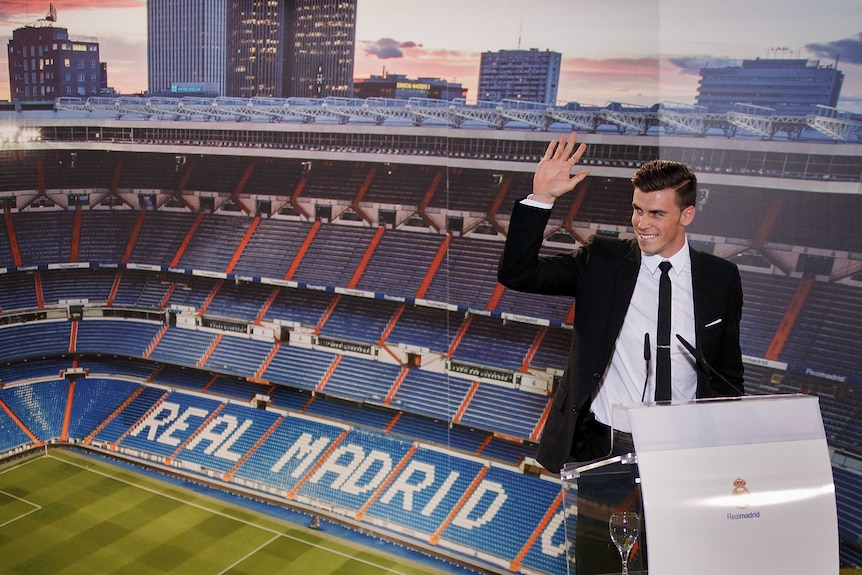 Gareth Bale greets the audience as he is presented as a Real Madrid player.