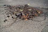 Pothole on bitumen road.