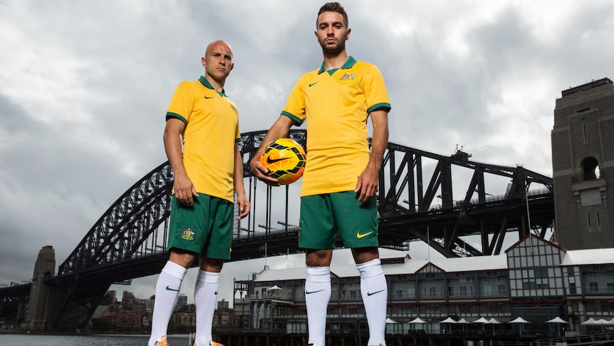 Mark Bresciano and Michael Zullo model the Socceroos' World Cup kit