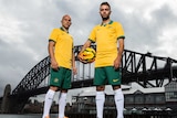 Mark Bresciano and Michael Zullo model the Socceroos' World Cup kit