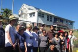 About 30 locals gather to protest the demolition of a home with heritage values at Highgate Hill in Brisbane's inner-city.