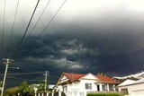 Storm clouds roll in over the Brisbane suburb of Annerley on October 15, 2011.