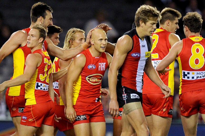 Gary Ablett is congratulated by teammates